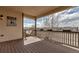 Covered deck featuring wood flooring and railing with flower boxes overlooking neighborhood at 4032 Donnington Cir, Castle Rock, CO 80104