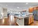 Open-concept kitchen with granite countertops and an island overlooking the spacious living area at 4032 Donnington Cir, Castle Rock, CO 80104