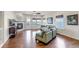 Open living room with hardwood floors, fireplace, and large windows offering great views at 4032 Donnington Cir, Castle Rock, CO 80104