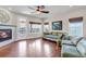 Bright and inviting living room featuring a fireplace, hardwood floors, and comfortable seating at 4032 Donnington Cir, Castle Rock, CO 80104