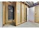 Unfinished basement with installed wall safe and open doorway at 7796 S Marshall Ct, Littleton, CO 80128