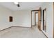 Bedroom featuring neutral carpet, ceiling fan, and doors leading to hallway and closet at 7796 S Marshall Ct, Littleton, CO 80128