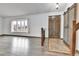Welcoming entryway featuring wood-look floors, a bay window and a rustic barn door at 7796 S Marshall Ct, Littleton, CO 80128