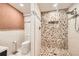 Well-lit bathroom with a mosaic tile shower and modern fixtures, creating a stylish space at 1805 August Ln, Brighton, CO 80601