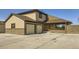 Stylish two-story home featuring a two-car garage and a stone-accented facade at 1805 August Ln, Brighton, CO 80601