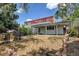 Backyard features a patio, red upper deck and a yard area at 1487 S Zeno Way, Aurora, CO 80017