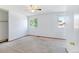 White walled bedroom features a ceiling fan and two windows for ample natural light at 1487 S Zeno Way, Aurora, CO 80017