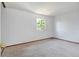 Bright bedroom features neutral carpeting and a window providing natural light at 1487 S Zeno Way, Aurora, CO 80017