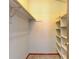 Walk in closet with open shelving and a hanging rod at 1487 S Zeno Way, Aurora, CO 80017