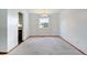 Dining room with neutral carpeting and a window providing natural light at 1487 S Zeno Way, Aurora, CO 80017