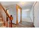 Hallway with staircase and decorative floors and lighting at 1487 S Zeno Way, Aurora, CO 80017