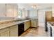 A spacious kitchen with granite countertops, stainless appliances and two-tone cabinets at 1487 S Zeno Way, Aurora, CO 80017