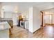 A spacious kitchen with granite countertops, stainless appliances and new vinyl plank flooring at 1487 S Zeno Way, Aurora, CO 80017