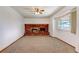 Inviting living room with a cozy brick fireplace and neutral carpet at 1487 S Zeno Way, Aurora, CO 80017