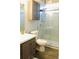 Updated bathroom with glass shower and modern vanity at 3825 S Monaco Pkwy # 111, Denver, CO 80237