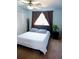 Cozy bedroom with natural light and a ceiling fan, offering a comfortable and relaxing space at 3825 S Monaco Pkwy # 111, Denver, CO 80237