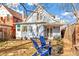 View of the home from the backyard with blue chairs at 4508 W 34Th Ave, Denver, CO 80212