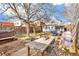 Backyard with patio furniture, hot tub, and a wooden table at 4508 W 34Th Ave, Denver, CO 80212