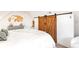 Spacious bedroom with barn doors and stylish decor at 4508 W 34Th Ave, Denver, CO 80212