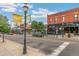 Street view of Highland Square featuring restaurants and shops, with vibrant street lighting and signage at 4508 W 34Th Ave, Denver, CO 80212