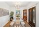 Elegant dining room with modern decor, chandelier, and a stylish glass-top table with seating for six at 4508 W 34Th Ave, Denver, CO 80212