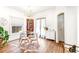 Bright dining room features hardwood floors, a glass table, and an elegant chandelier at 4508 W 34Th Ave, Denver, CO 80212