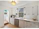 Bright, white kitchen features sleek countertops, stainless steel appliances, and ample cabinet space at 4508 W 34Th Ave, Denver, CO 80212