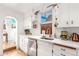 Clean and bright kitchen with white cabinets and stainless steel appliances at 4508 W 34Th Ave, Denver, CO 80212