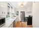 Updated kitchen with white cabinets, stainless steel appliances, and bright, airy feel at 4508 W 34Th Ave, Denver, CO 80212