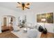 Bright living room with hardwood floors, white walls, stylish decor, ceiling fan and comfortable seating at 4508 W 34Th Ave, Denver, CO 80212