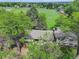 Aerial view of a home surrounded by lush greenery and expansive green fields at 14650 Tejon St, Broomfield, CO 80023
