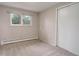 Empty bedroom with neutral walls, carpet, closet with sliding doors and a window at 14650 Tejon St, Broomfield, CO 80023