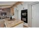 This kitchen boasts built-in double ovens, wooden countertops, exposed ceiling beams, and an island at 14650 Tejon St, Broomfield, CO 80023