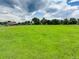 Vast green field with a clear blue sky and scattered clouds, ideal for development or recreation at 14650 Tejon St, Broomfield, CO 80023