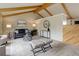Cozy living room boasts vaulted ceilings, warm accents and a large window for abundant natural light at 14650 Tejon St, Broomfield, CO 80023