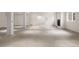 Spacious unfinished basement ready for customization, featuring concrete flooring and natural light at 4800 E Cedar Ave, Denver, CO 80246