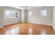 Bright bedroom boasts hardwood floors, natural light, and a modern design with recessed lighting at 4800 E Cedar Ave, Denver, CO 80246