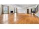 Expansive open-concept living area with fireplace, hardwood floors, and great natural light at 4800 E Cedar Ave, Denver, CO 80246