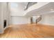 Open concept living room featuring high ceilings, fireplace, and staircase to the upper level at 4800 E Cedar Ave, Denver, CO 80246