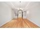 Spacious living room with hardwood floors and elegant chandelier at 4800 E Cedar Ave, Denver, CO 80246