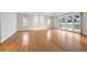 Spacious main bedroom with hardwood floors and access to a private balcony with winter views at 4800 E Cedar Ave, Denver, CO 80246
