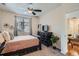 Cozy bedroom featuring neutral colors, a large window, ceiling fan and comfortable furnishings at 4100 Albion St # 611, Denver, CO 80216