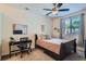 Bedroom with natural light, a desk, a bed, and simple decorations to create a peaceful space at 4100 Albion St # 611, Denver, CO 80216