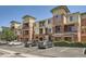 Exterior of a multi-story apartment building featuring brick accents and well-maintained landscaping at 4100 Albion St # 611, Denver, CO 80216