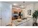 Bright kitchen featuring stainless steel appliances, granite countertops and ample cabinet space at 4100 Albion St # 611, Denver, CO 80216