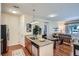 Open concept living space with a dining area, kitchen, and living room with lots of light at 4100 Albion St # 611, Denver, CO 80216