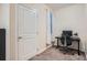 Functional home office with window and neutral carpet at 4100 Albion St # 611, Denver, CO 80216