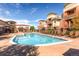 Community pool with plenty of lounge chairs at 4100 Albion St # 611, Denver, CO 80216