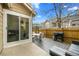 Inviting back patio with outdoor seating, grill, and sliding glass door access at 1061 S Yampa St # C, Aurora, CO 80017