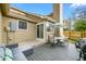 Cozy back patio featuring comfortable seating, outdoor dining set, and a well-maintained wooden fence at 1061 S Yampa St # C, Aurora, CO 80017
